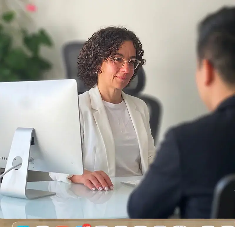 HR consultant meeting with a client at a desk